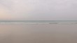 red jersey woman walks to the sea 43