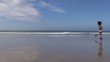 woman footing next to the sea