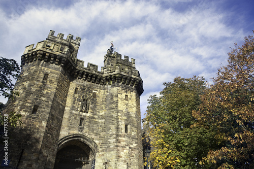 Photo: Medieval castle over cloudy beautiful sky Medieval castle over cloudy beautiful sky
