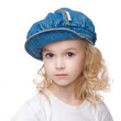 Little calm girl portrait in cap