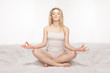 Beautiful blonde woman meditating