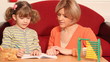 little girl working her homework and making a mistake