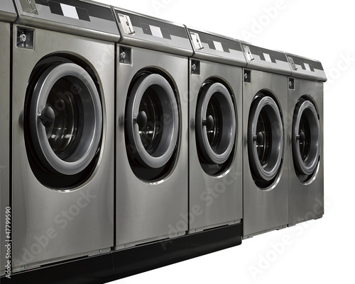 Photo: A row of industrial washing machines in a public laundromat A row of industrial washing machines in a public laundromat