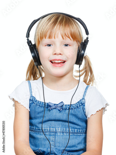 Photo: Little girl wearing headphones Little girl wearing headphones