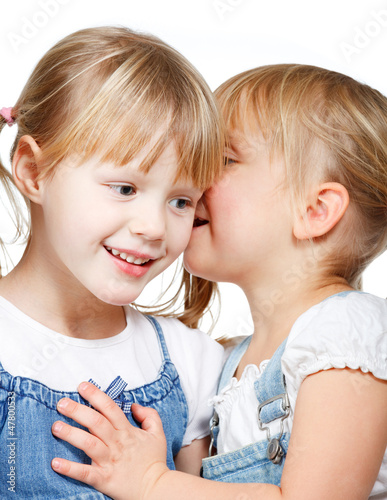 Photo: Little girls sharing a secret Little girls sharing a secret