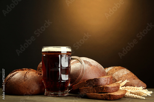 Photo: tankard of kvass and rye breads with ears, tankard of kvass and rye breads with ears,