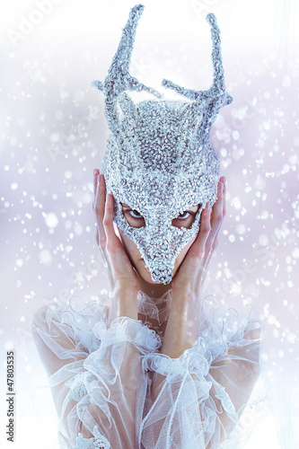 Photo: beautiful woman face in mask beautiful woman face in mask
