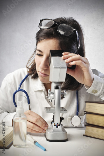 Photo: Researcher with Microscope Researcher with Microscope
