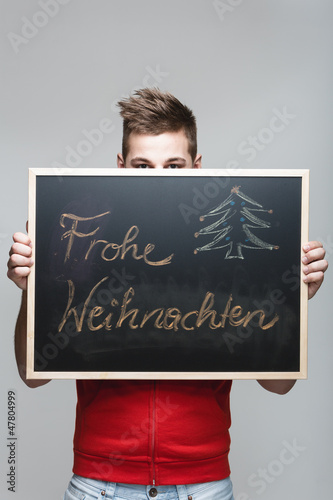 Photo: Frohe Weihnachten auf einer Tafel Frohe Weihnachten auf einer Tafel