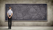 Business person against the blackboard