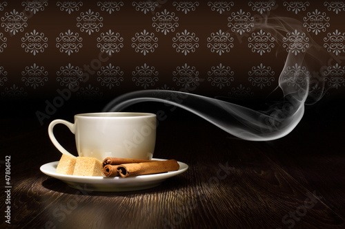 Photo: Coffee beans and white cup Coffee beans and white cup