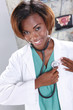 Doctor checks her heart beat