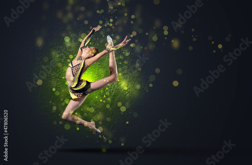 Photo: Young woman in gymnast suit posing Young woman in gymnast suit posing