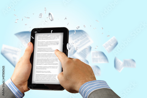 Photo: e book reader and books e book reader and books