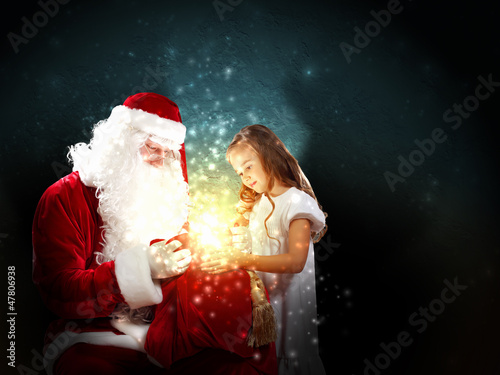 Photo: portrait of santa claus with a girl portrait of santa claus with a girl