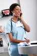 Cute afro-american doctor at her office