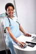 Cute afro-american doctor at her office
