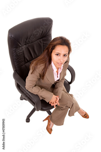 Photo: Portrait of beautiful young woman sitting on chair, isolated on Portrait of beautiful young woman sitting on chair, isolated on