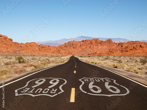 Photo: Route 66 Pavement Sign with Red Rock Mountains Route 66 Pavement Sign with Red Rock Mountains