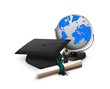 Graduation hat, diploma and globe