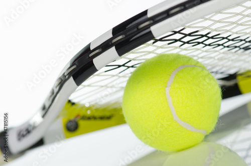 Photo: Tennis ball and racket Tennis ball and racket