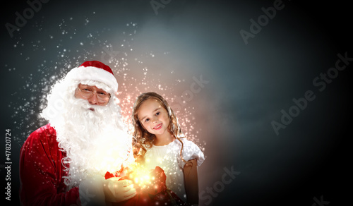 Photo: portrait of santa claus with a girl portrait of santa claus with a girl