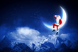 photo of santa claus sitting on the moon