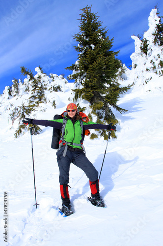 Photo: Winter hiking in snowshoes. Winter hiking in snowshoes.