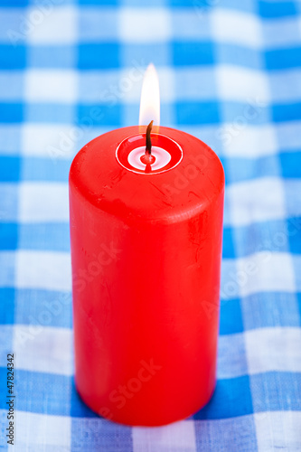Photo: Big red candle burning Big red candle burning