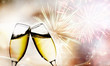 Photo: Glasses with champagne against fireworks Glasses with champagne against fireworks