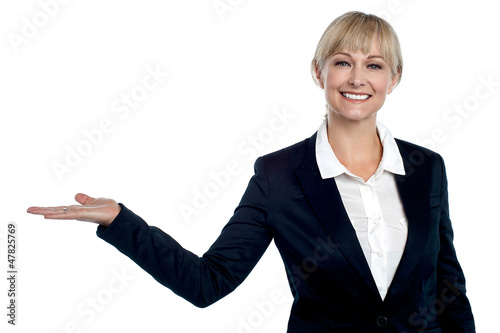 Photo: Cheerful business executive presenting copy space area Cheerful business executive presenting copy space area