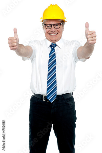 Photo: Business architect showing double thumbs up Business architect showing double thumbs up