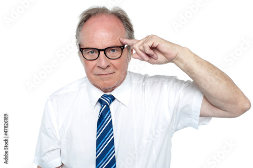 Photo: Senior corporate immersed in deep thoughts Senior corporate immersed in deep thoughts