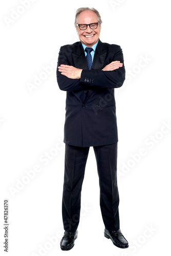 Photo: Confident cheerful matured businessperson Confident cheerful matured businessperson