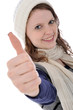 Junge Frau in Winterkleidung "Daumen hoch"