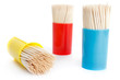 Cocktail sticks in containers, white background