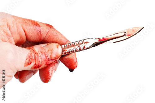 Photo: Bloody hand with sharp surgeon scalpel , isolated Bloody hand with sharp surgeon scalpel , isolated
