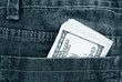 Photo: Dollars in a pocket. Monochrome Dollars in a pocket. Monochrome