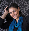 Portrait of smiling beautiful young woman in studio