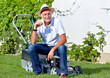 Foto: Senior man take a break after cuting the grass Senior man take a break after cuting the grass