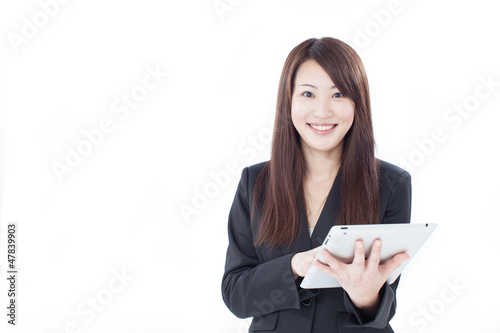 Photo: タブレットを持ったビジネスウーマン タブレットを持ったビジネスウーマン