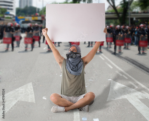 Photo: man in street protest man in street protest