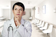 Thinking medical doctor thinking looking up smiling, Medical wom