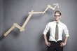 Foto: Confident businessman with graph. Confident businessman with graph.