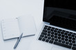 Open notebook with laptop