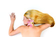 portrait of a young beautiful blonde girl with white flower