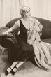 Vintage woman on chaise-longue
