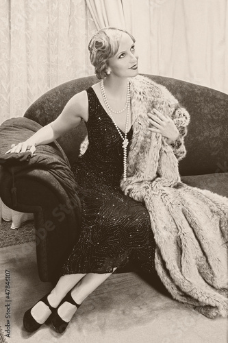 Photo: Vintage woman on chaise-longue Vintage woman on chaise-longue