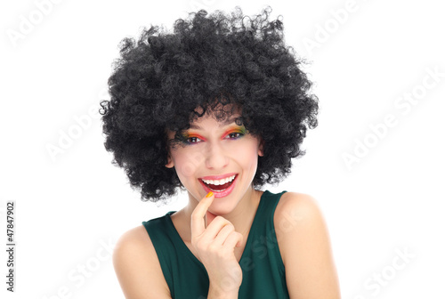 Photo: Woman wearing black afro wig Woman wearing black afro wig