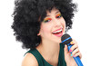 Woman with afro holding microphone